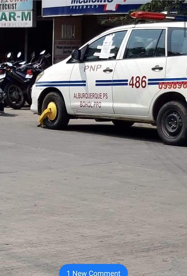 Photo of police car clamped in Tagbilaran goes viral